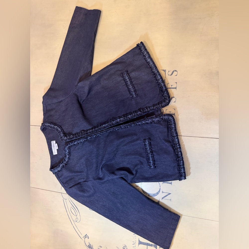 Blue denim stretch jacket with decorative trim. Blazer or outdoor jacket.